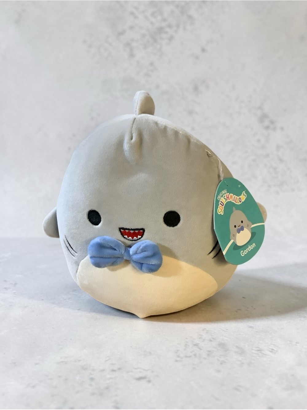 Squishmallows Gordon Gray and Cream Seal Plush with Blue Bow